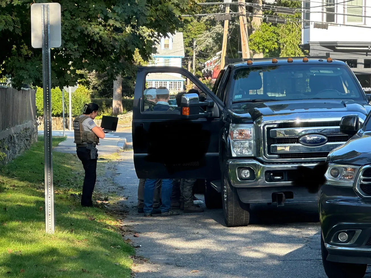 Witnesses report officers in FBI-marked vests detaining landscaping workers in Marblehead